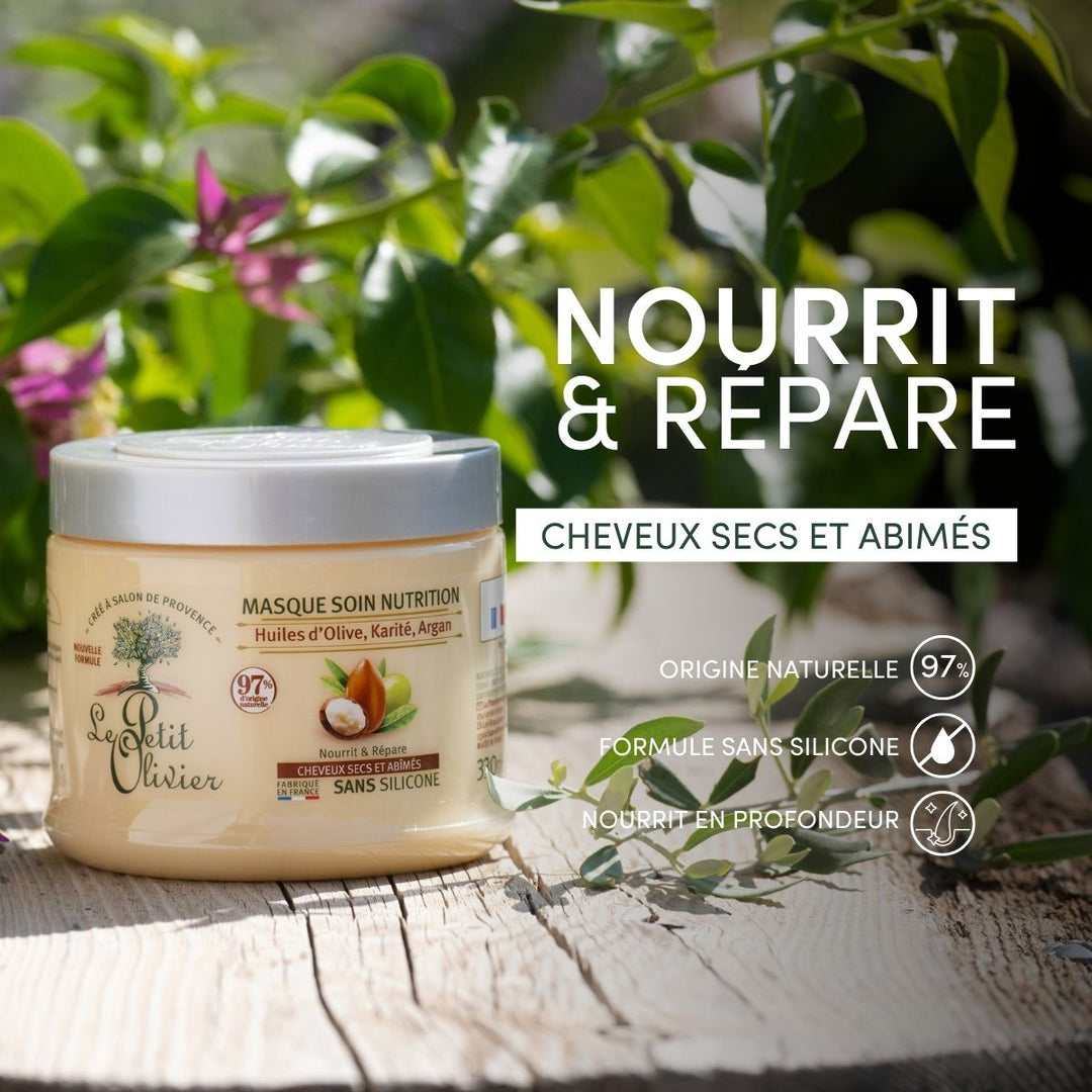 Un pot de « Le Petit Olivier Masque Cheveux Secs et Abîmés » est posé à l'extérieur sur une surface naturelle, au milieu de la verdure. Le texte met en avant son action nourrissante et réparatrice pour les cheveux secs et abîmés, grâce à une formule naturelle sans silicone.