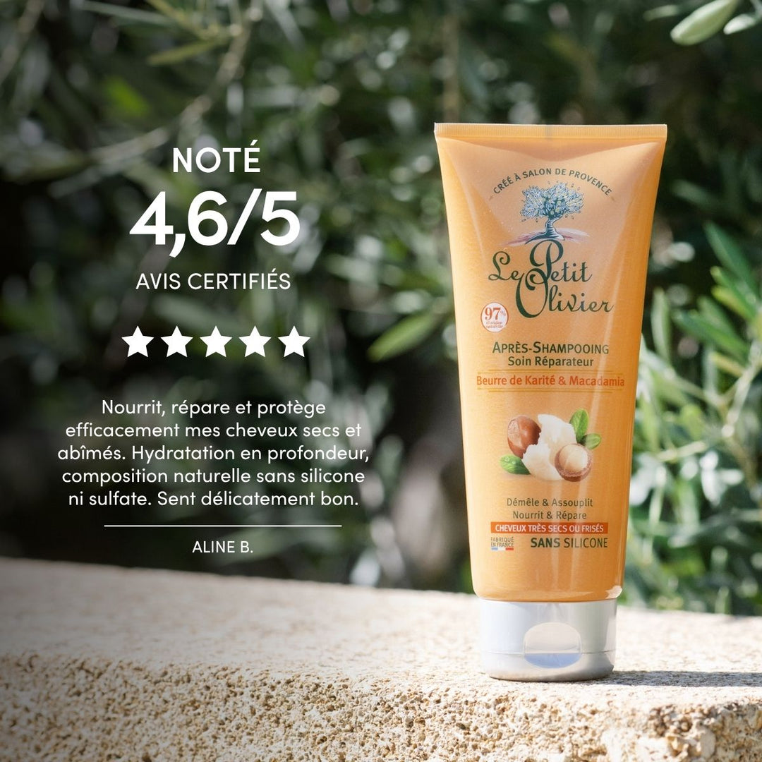 Un tube d'après-shampoing « Le Petit Olivier » pour cheveux très secs ou frisés est posé sur une pierre à l'extérieur, au milieu de la verdure. L'image présente une note client de 4,6/5 ainsi qu'un avis élogieux rédigé en français.