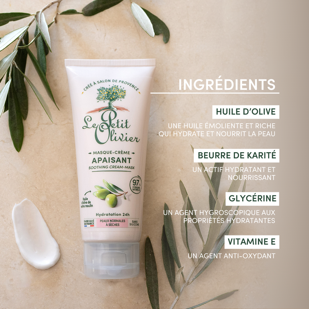 Un tube de « Le Petit Olivier Masque Visage Hydratant 24h » repose sur une surface beige ornée de feuilles d'olivier, son bouchon étant ouvert. Le texte met en avant les ingrédients clés : huile d'olive, beurre de karité, glycérine et vitamine E — idéaux pour les peaux sèches.