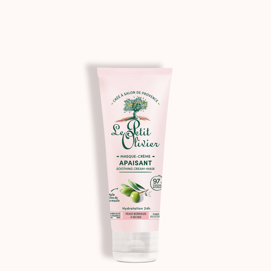 Un tube rose du « Masque Visage Hydratant 24h » de Le Petit Olivier, orné d’illustrations d’olives et d’un texte en vert. L’étiquette mentionne « huile d’olive » pour les peaux sèches, 97 % d’ingrédients d’origine naturelle et une hydratation 24 heures sur 24.