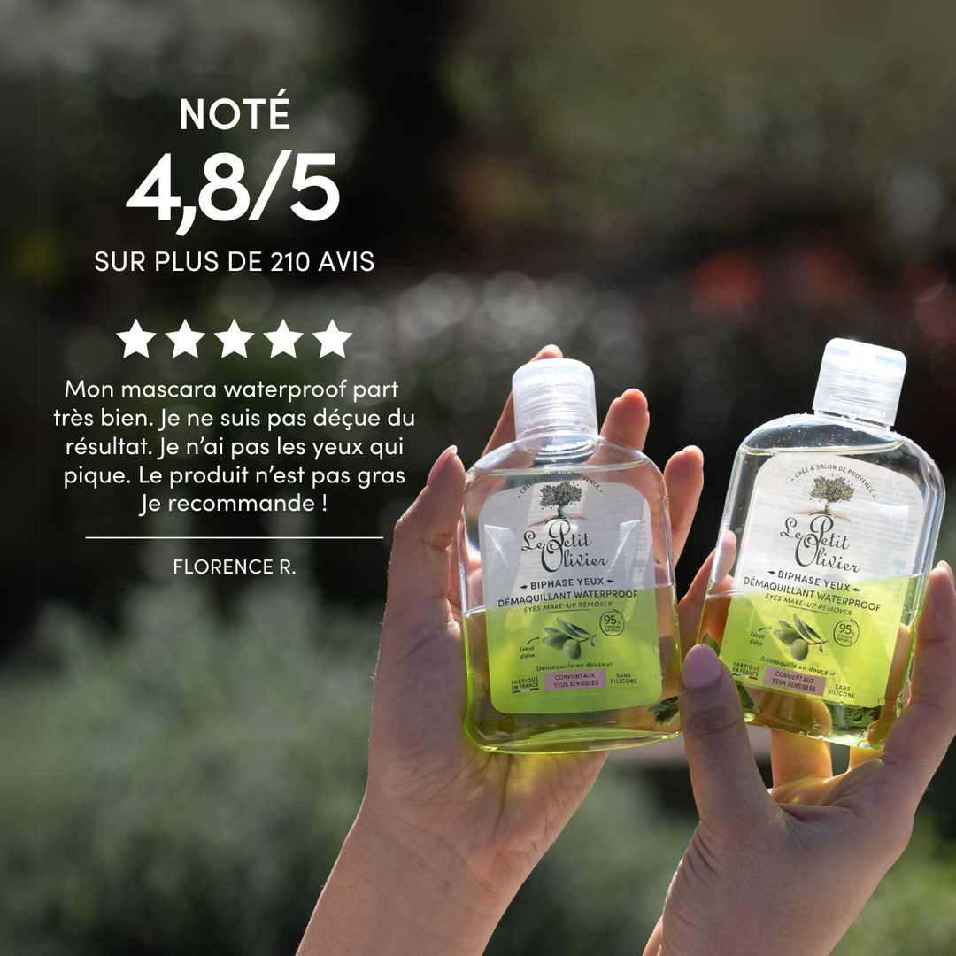 Deux mains tiennent des flacons de « Le Petit Olivier Démaquillant Yeux Sensibles Waterproof », noté 4,8/5 sur la base de plus de 210 avis, accompagnés d'un témoignage élogieux en français. Sa formule douce à l'huile d'olive est idéale pour les yeux sensibles.