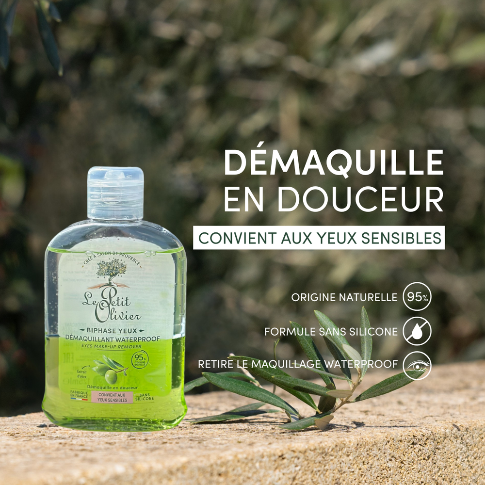 Le Démaquillant pour Yeux Sensibles Waterproof de Le Petit Olivier, enrichi en huile d'olive nourrissante et composé à 95 % d'ingrédients d'origine naturelle, repose sur une pierre à l'extérieur ; sa formule douce est idéale pour les yeux sensibles.