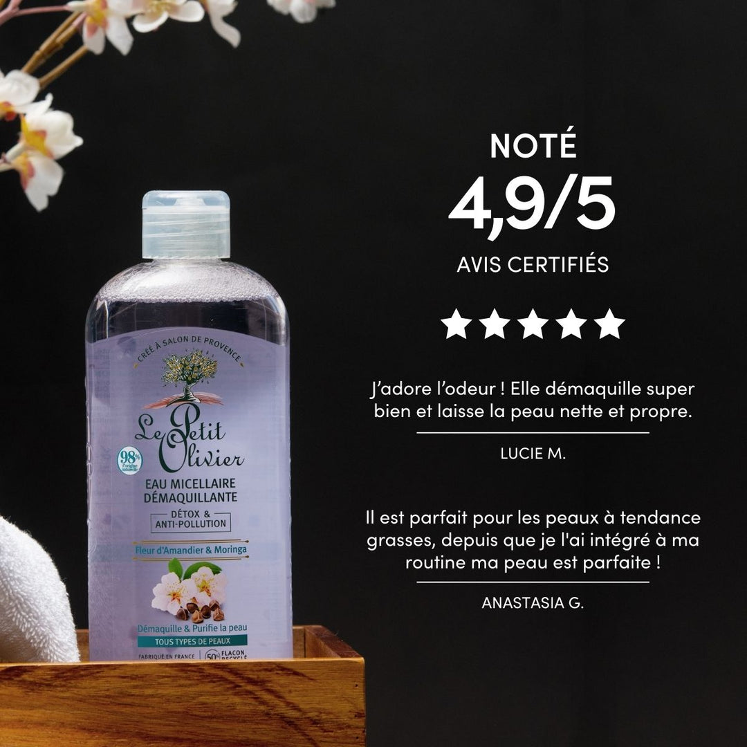 A bottle of Eau Micellaire Démaquillante Detox & Anti-Pollution rests on a wooden tray with white flowers nearby. The image shows a 4.9/5 rating and positive reviews highlighting its anti-pollution cleansing power.