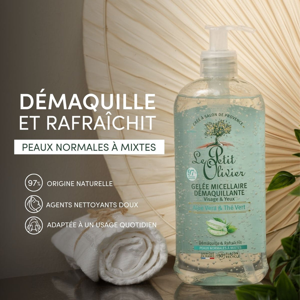 A bottle of Gelée Micellaire Démaquillante Visage & Yeux stands next to a rolled white towel and green leaves, with French text highlighting its natural origin, gentle cleansing, and suitability for normal to combination skin.