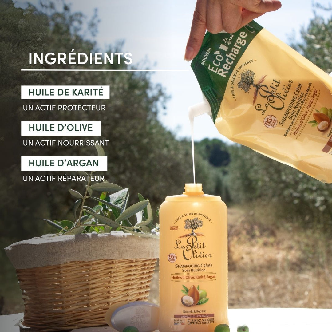 Une main verse du shampoing « Le Petit Olivier Eco-Recharge pour cheveux secs et abîmés » dans un flacon, à l'extérieur, près d'un panier et de plantes. Le texte met en avant les huiles d'olive, de karité et d'argan comme ingrédients clés.