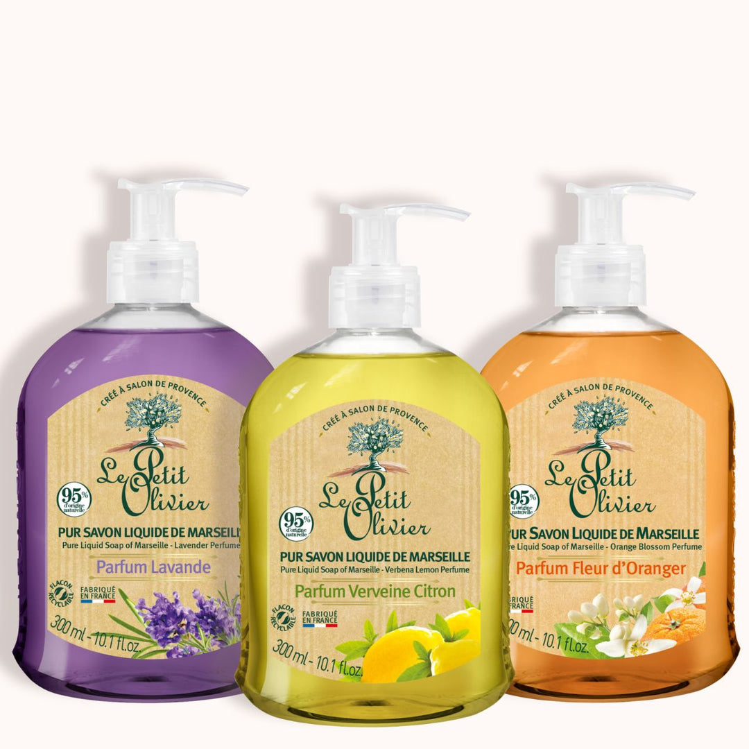 Le coffret « Découverte - Purs Savons Liquides de Marseille » de Le Petit Olivier comprend trois flacons à pompe portant des étiquettes en français : lavande (violet), verveine citronnée (jaune) et fleur d'oranger (orange), le tout sur fond blanc.