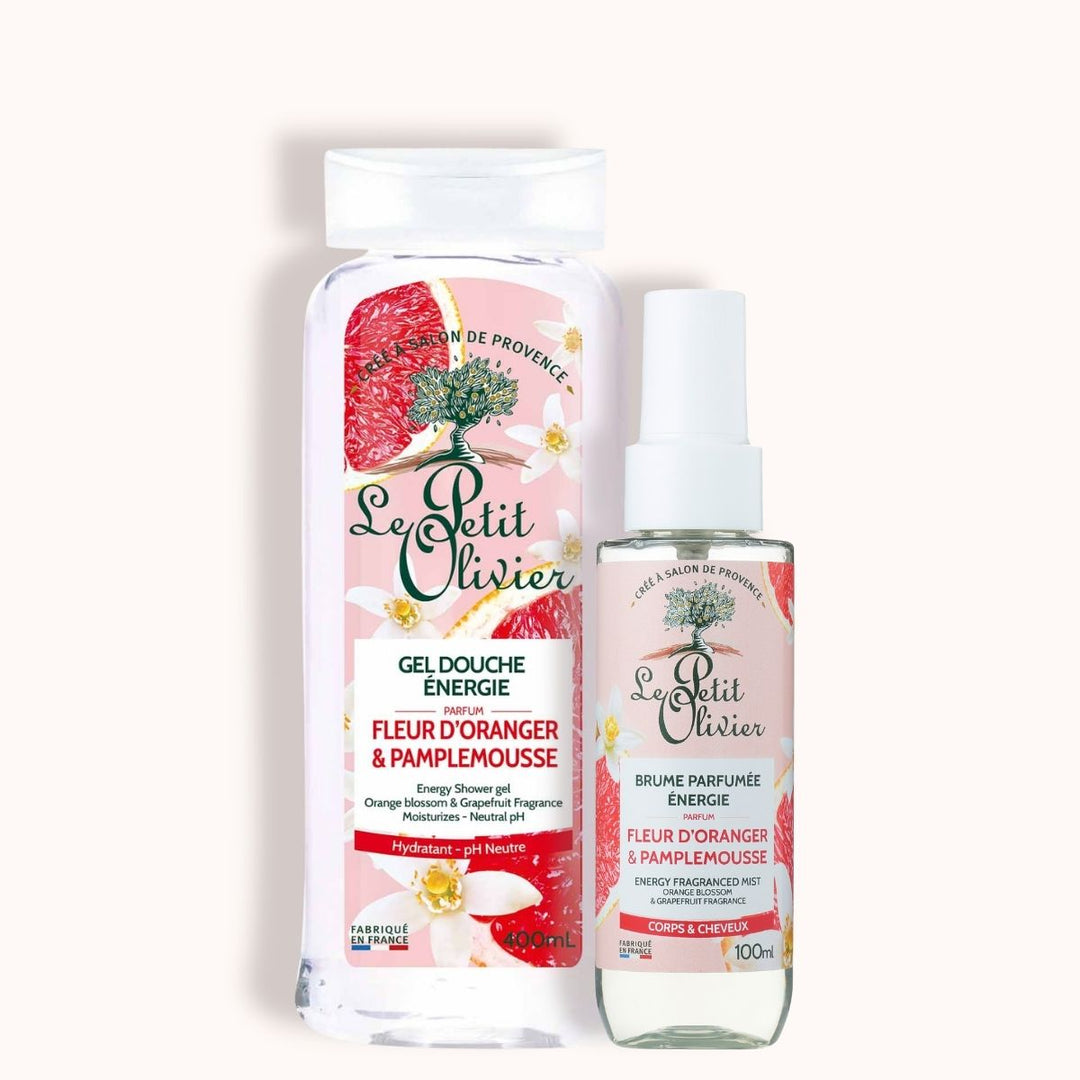 Le coffret « Duo Énergie » de Le Petit Olivier comprend un gel douche de 500 ml et une brume parfumée de 100 ml, tous deux au parfum de pamplemousse et de fleur d'oranger, avec des étiquettes à motifs floraux.